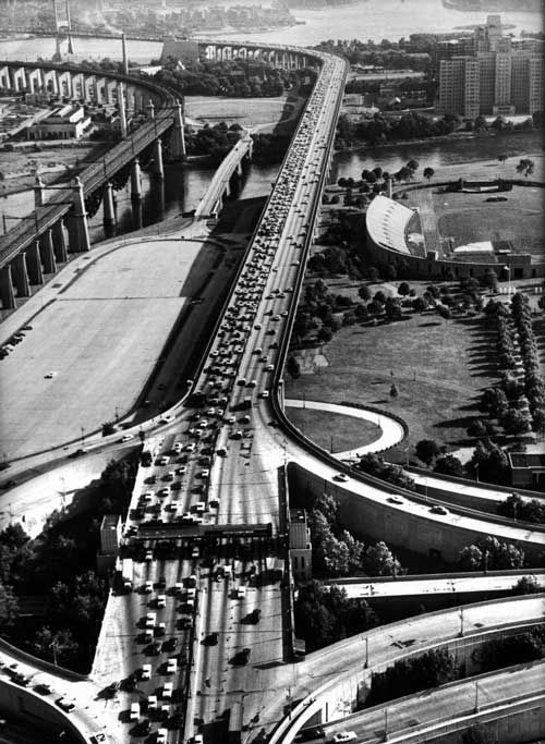"Heavy 4th of July holiday road traffic near bridge crossing." July 1959